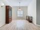 Spacious dining area featuring wood floors and large window at 243 New River Dr, Kissimmee, FL 34759