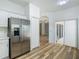 Modern kitchen with stainless steel refrigerator and access to backyard at 243 New River Dr, Kissimmee, FL 34759