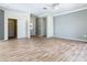 Bright living room with wood-look floors and neutral walls at 243 New River Dr, Kissimmee, FL 34759