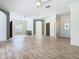 Spacious living area with hardwood floors and access to other rooms at 243 New River Dr, Kissimmee, FL 34759