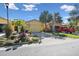 Community view showing a neighborhood of well-maintained homes with lush landscaping at 2448 Palm Tree Dr, Kissimmee, FL 34759