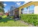 Private screened patio with lush landscaping and grassy area at 2448 Palm Tree Dr, Kissimmee, FL 34759