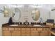 Elegant bathroom with double sinks, granite counters, and a large shower at 2448 Palm Tree Dr, Kissimmee, FL 34759