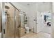 Bathroom with toilet, shower, and access to bedroom at 2448 Palm Tree Dr, Kissimmee, FL 34759
