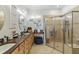 Bathroom with a walk-in shower and double vanity at 2448 Palm Tree Dr, Kissimmee, FL 34759
