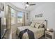 Cozy bedroom with a comfortable bed and window seating at 2448 Palm Tree Dr, Kissimmee, FL 34759