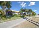 View of home's exterior, showcasing landscaping and community at 2448 Palm Tree Dr, Kissimmee, FL 34759