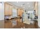 Modern kitchen featuring wood cabinets, granite countertops, and stainless steel appliances at 2448 Palm Tree Dr, Kissimmee, FL 34759