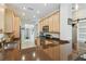 Spacious kitchen with breakfast bar, granite countertops, and stainless steel appliances at 2448 Palm Tree Dr, Kissimmee, FL 34759