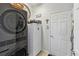 Convenient laundry room with washer, dryer, and extra storage at 2448 Palm Tree Dr, Kissimmee, FL 34759
