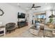 Cozy living room features fireplace and access to backyard patio at 2448 Palm Tree Dr, Kissimmee, FL 34759