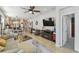 Relaxing living room with comfortable seating and large TV at 2448 Palm Tree Dr, Kissimmee, FL 34759