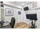 Home office with wood floors and exercise bike at 2448 Palm Tree Dr, Kissimmee, FL 34759
