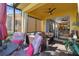 Relaxing screened porch with outdoor furniture and view of backyard at 2448 Palm Tree Dr, Kissimmee, FL 34759