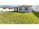 Home with grassy backyard and screened patio at 2756 Greenlands St, St Cloud, FL 34772