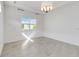 Sunlit bedroom with tile floors and window at 2756 Greenlands St, St Cloud, FL 34772