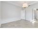 Bright and spacious bedroom with a chandelier and tile floor at 2756 Greenlands St, St Cloud, FL 34772