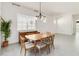 Dining room with wood table and chairs, and large window at 2756 Greenlands St, St Cloud, FL 34772