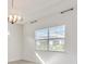 Bright dining room with large window and chandelier at 2756 Greenlands St, St Cloud, FL 34772