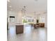 Open concept kitchen and dining area with modern lighting at 2756 Greenlands St, St Cloud, FL 34772