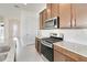 Kitchen with stainless steel appliances and granite countertops at 2756 Greenlands St, St Cloud, FL 34772
