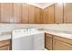 Laundry room with cabinets and granite countertop at 2756 Greenlands St, St Cloud, FL 34772