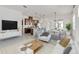 Open living room featuring a spacious layout, modern furniture, and large TV at 2756 Greenlands St, St Cloud, FL 34772
