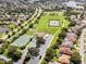 Community view with park, tennis courts, and homes at 2835 Crane Trace Cir, Orlando, FL 32837