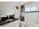 Clean bathroom with shower/tub combo and granite vanity at 2835 Crane Trace Cir, Orlando, FL 32837