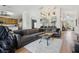 Open concept living room with a sectional sofa and access to kitchen at 2835 Crane Trace Cir, Orlando, FL 32837