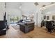 Open living room with a view of the pool and kitchen at 2835 Crane Trace Cir, Orlando, FL 32837