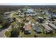 Aerial view of community with lake and numerous houses at 301 Evandee Ct, Kissimmee, FL 34758
