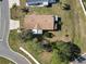 Aerial view of single-story house with surrounding yard and neighborhood at 301 Evandee Ct, Kissimmee, FL 34758