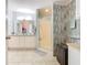 Bathroom with a walk-in shower, double vanity, and wood-look tile at 301 Evandee Ct, Kissimmee, FL 34758