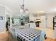 Bright dining room with a black and white checkered tablecloth and chandelier at 301 Evandee Ct, Kissimmee, FL 34758
