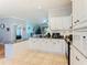 Spacious kitchen with white cabinets, granite countertops, and stainless steel appliances at 301 Evandee Ct, Kissimmee, FL 34758