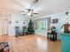 Living room features hardwood floors and a decorative wall at 301 Evandee Ct, Kissimmee, FL 34758