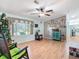 Living room with hardwood floors and access to the kitchen at 301 Evandee Ct, Kissimmee, FL 34758