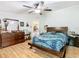 Large main bedroom with a king-size bed and wood dresser at 301 Evandee Ct, Kissimmee, FL 34758