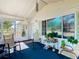Bright and airy screened porch furnished with rocking chairs at 301 Evandee Ct, Kissimmee, FL 34758