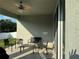 Covered patio with seating area, ceiling fan, and access to backyard at 3573 Bristol Cove Ln, St Cloud, FL 34772