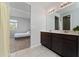 Bathroom with double vanity and a walk-in shower at 3573 Bristol Cove Ln, St Cloud, FL 34772