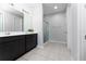 Clean bathroom with double vanity, and a shower at 3573 Bristol Cove Ln, St Cloud, FL 34772
