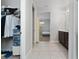 Bathroom with double vanity and a view of a bedroom at 3573 Bristol Cove Ln, St Cloud, FL 34772
