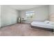 Bright bedroom with carpeted floor, bed, and window with natural light at 3573 Bristol Cove Ln, St Cloud, FL 34772