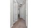 Clean hallway with carpeted floor and neutral-colored walls at 3573 Bristol Cove Ln, St Cloud, FL 34772