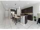 Modern kitchen with breakfast bar and stainless steel appliances at 3573 Bristol Cove Ln, St Cloud, FL 34772