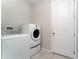 Convenient laundry room with washer and dryer, and extra storage at 3573 Bristol Cove Ln, St Cloud, FL 34772