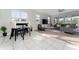 Open living area with tile flooring and access to a patio at 3573 Bristol Cove Ln, St Cloud, FL 34772