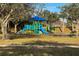 Community playground with slides, climbing structures, and shaded areas at 3573 Bristol Cove Ln, St Cloud, FL 34772